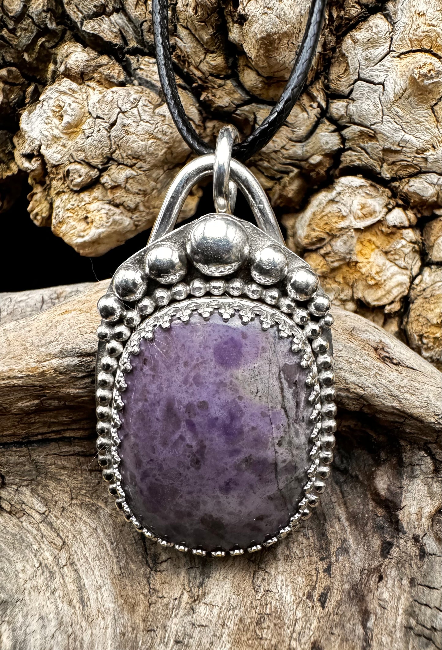 Purple jadeite pendant